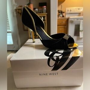 Nine West JELLZEY black satin gold heels & rhinestone accent.